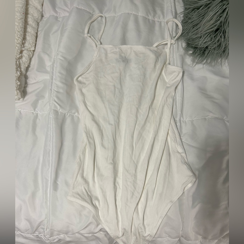 White body suit , tank top